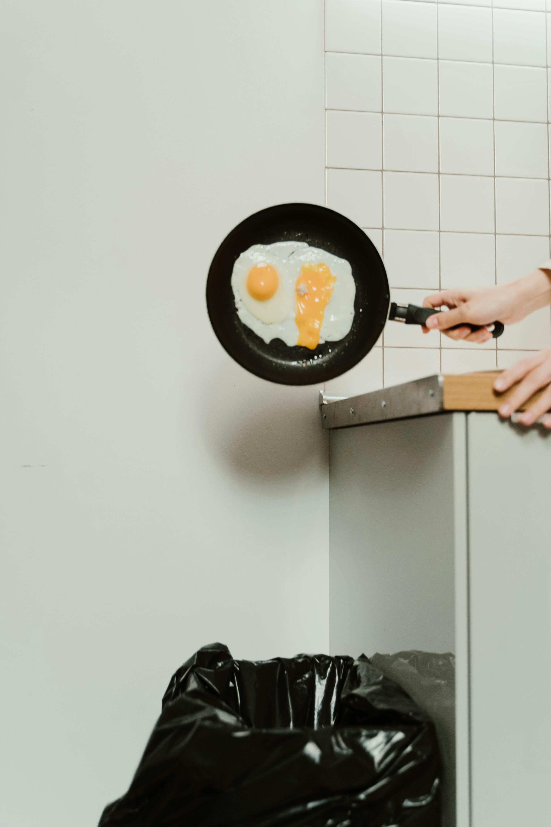 A Person Throwing Cooked Eggs · Free Stock Photo