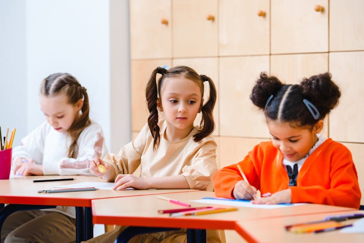 Children Studying Inside A Classroom 