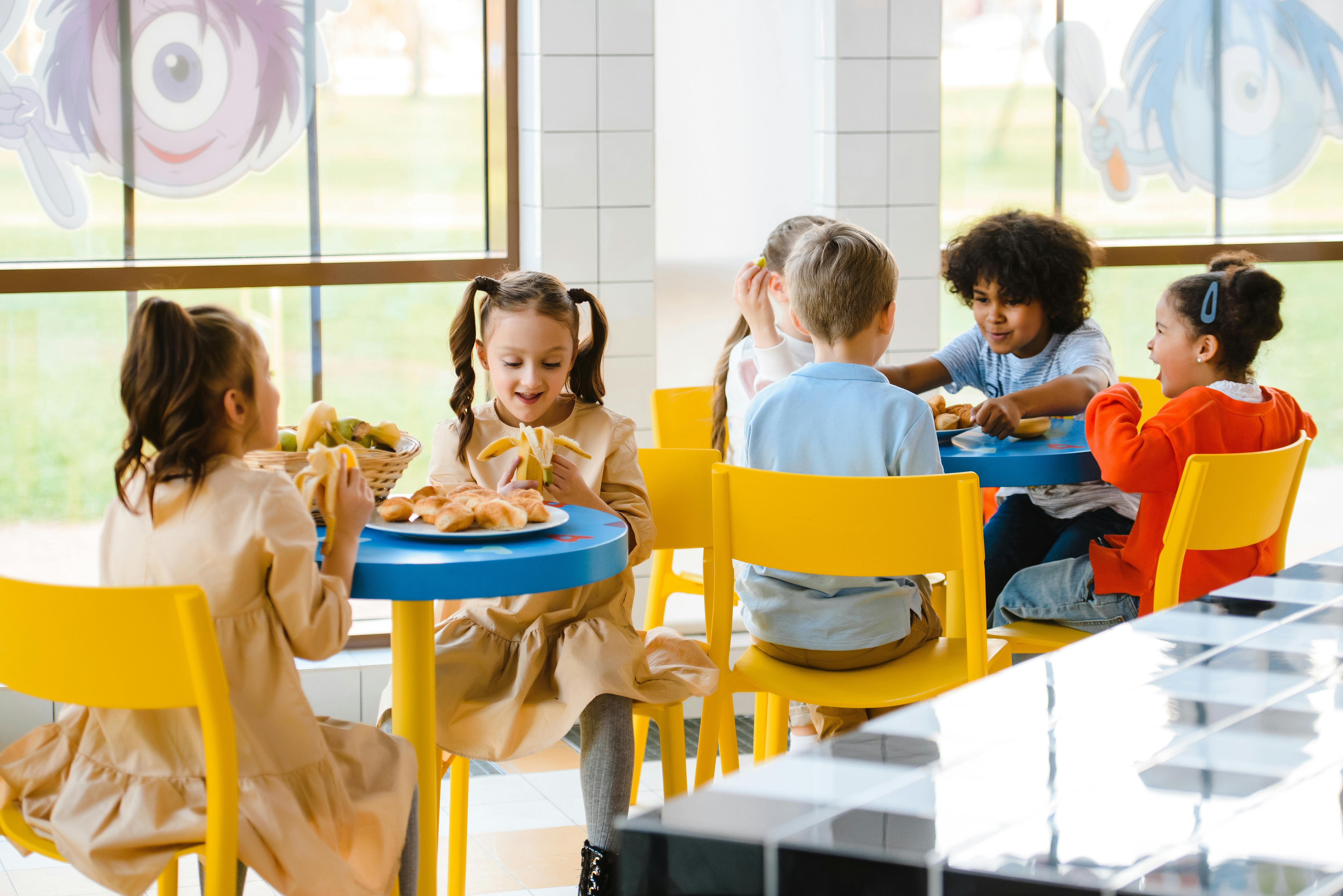 Children eating at the canteen Stock Photo by ©Wavebreakmedia 108970516