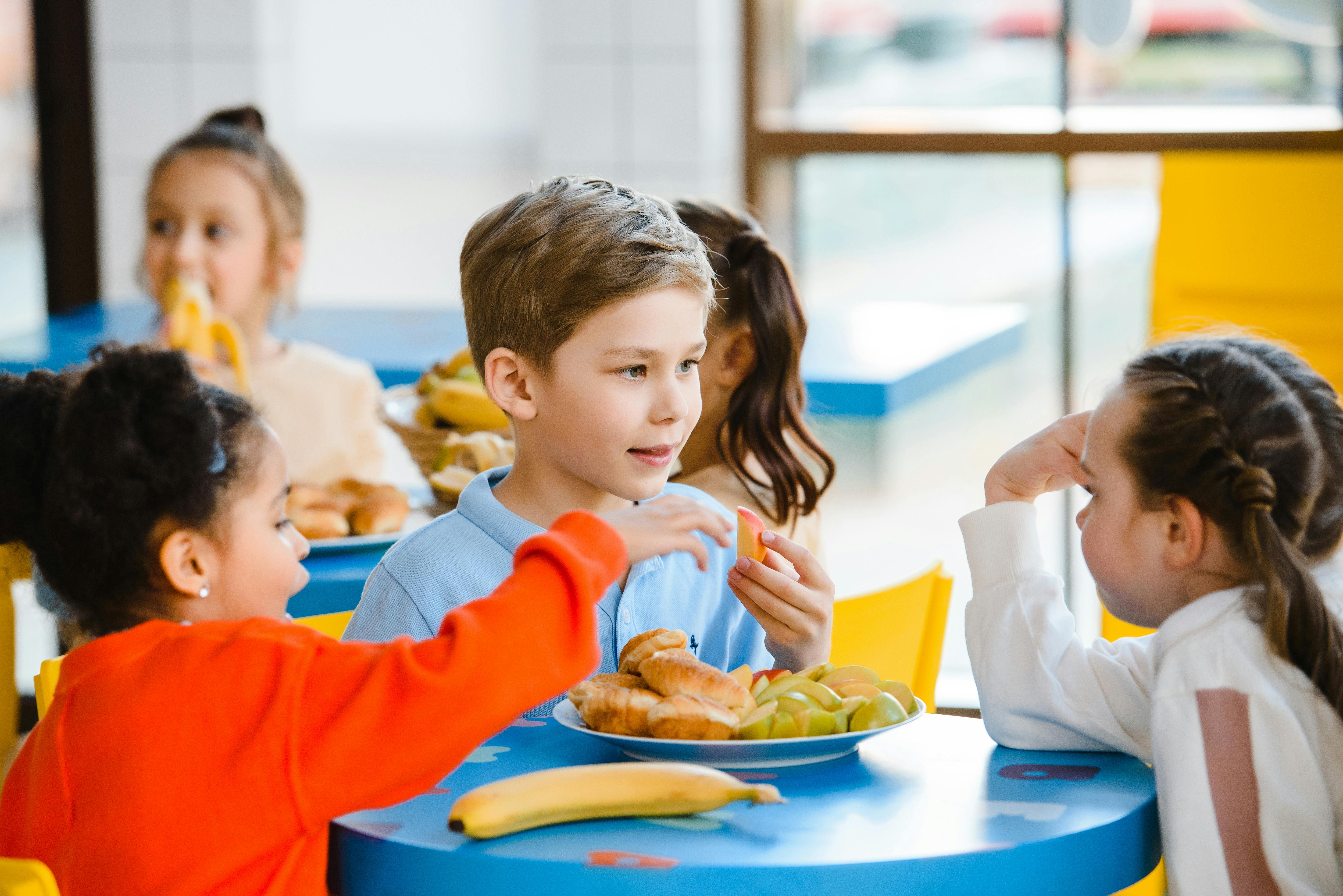 A Children Eating in the Canteen · Free Stock Photo