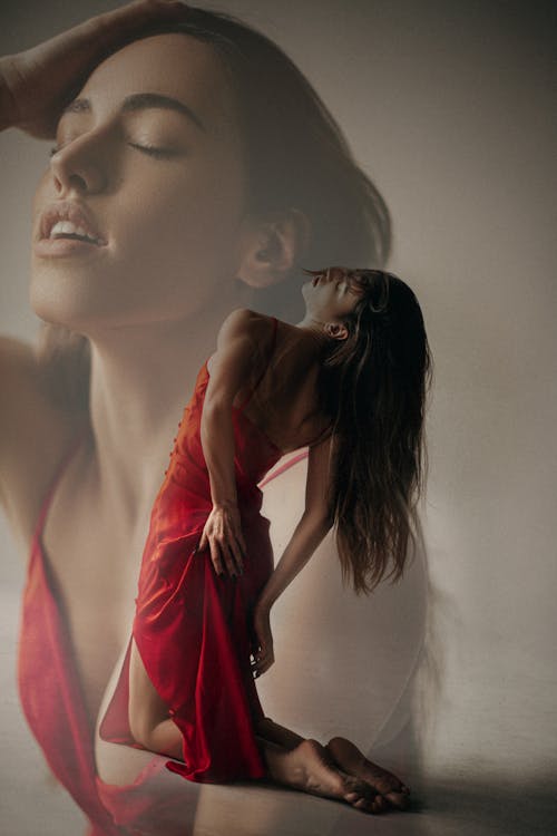 Double Exposure of Woman Posing in a Red Dress