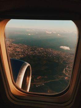 Stunning aerial view of Ankara, Turkey at sunset from airplane window with cityscape.