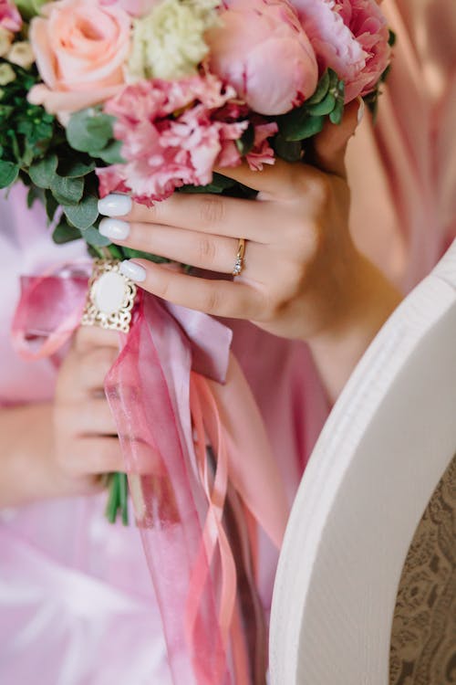 Close-up Photo of Pink Roses held by a Person 