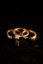 Close-up of Gold Rings on Black Surface