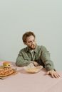 A Man Sitting at the Table