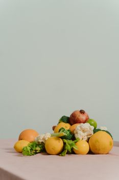Colorful organic fruits and vegetables arranged on a table with ample copyspace.