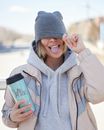 Woman Wearing a Beanie Smiling with Tongue Out