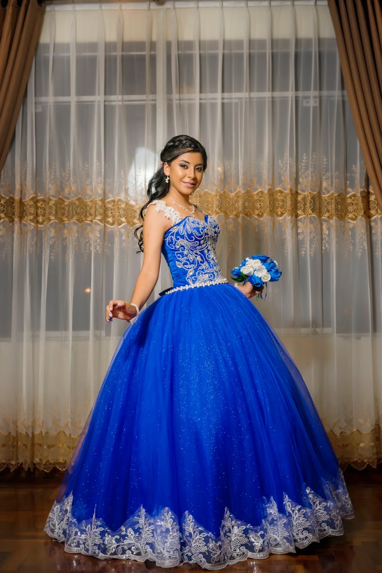 Young Woman In Blue Ball Gown 