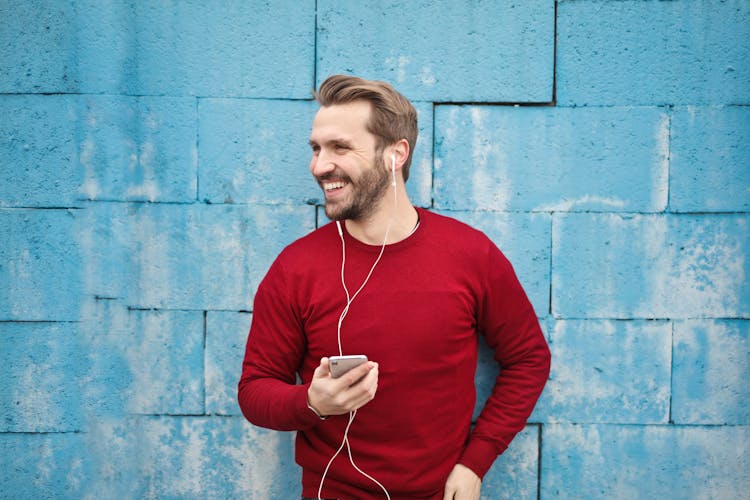 Photo Of A Man Listening Music On His Phone