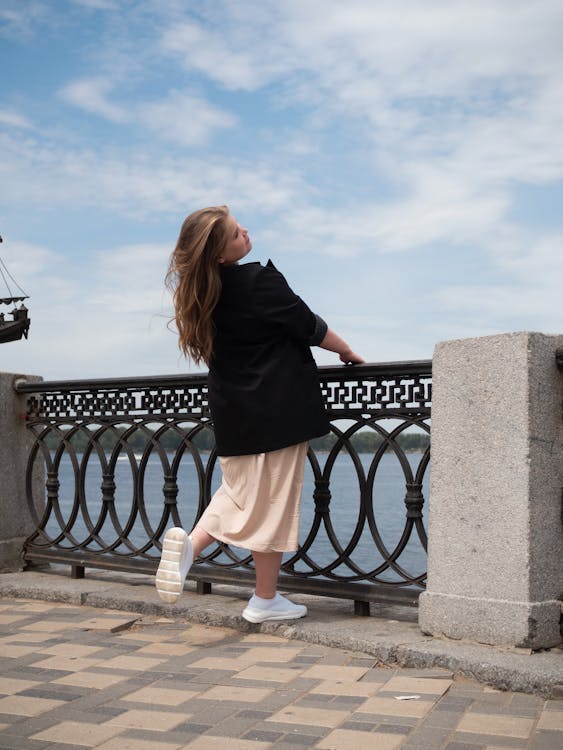 Woman Holding on the Railings