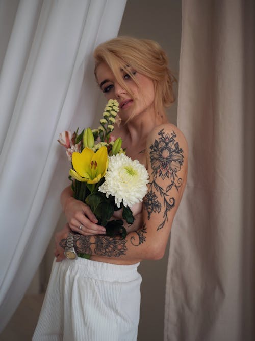 Free Topless Woman holding Flowers  Stock Photo