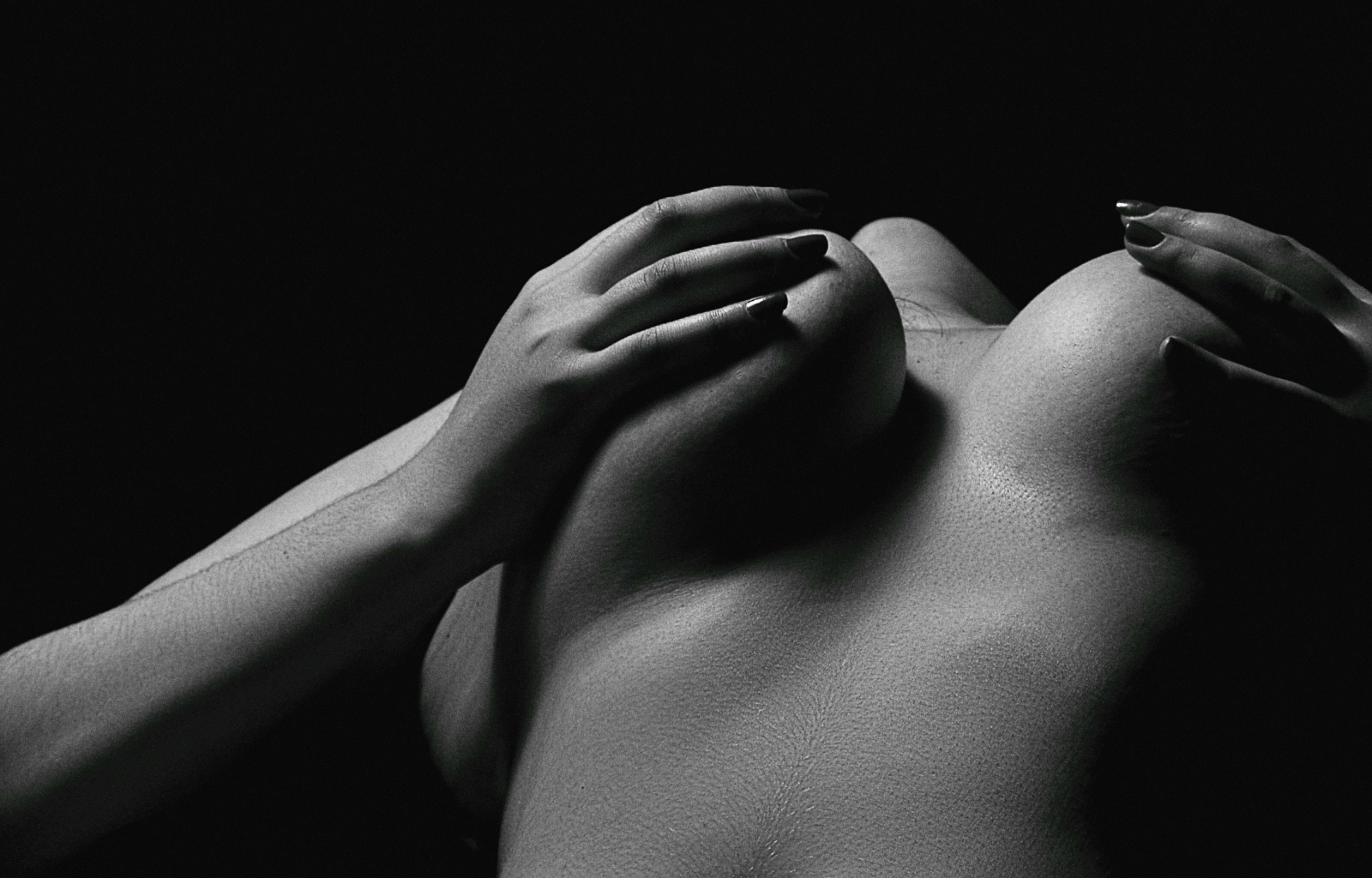 grayscale photo of woman s chest