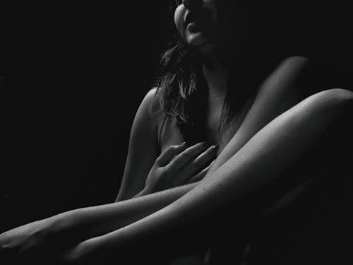 Grayscale Photo of Naked Woman Touching her Body