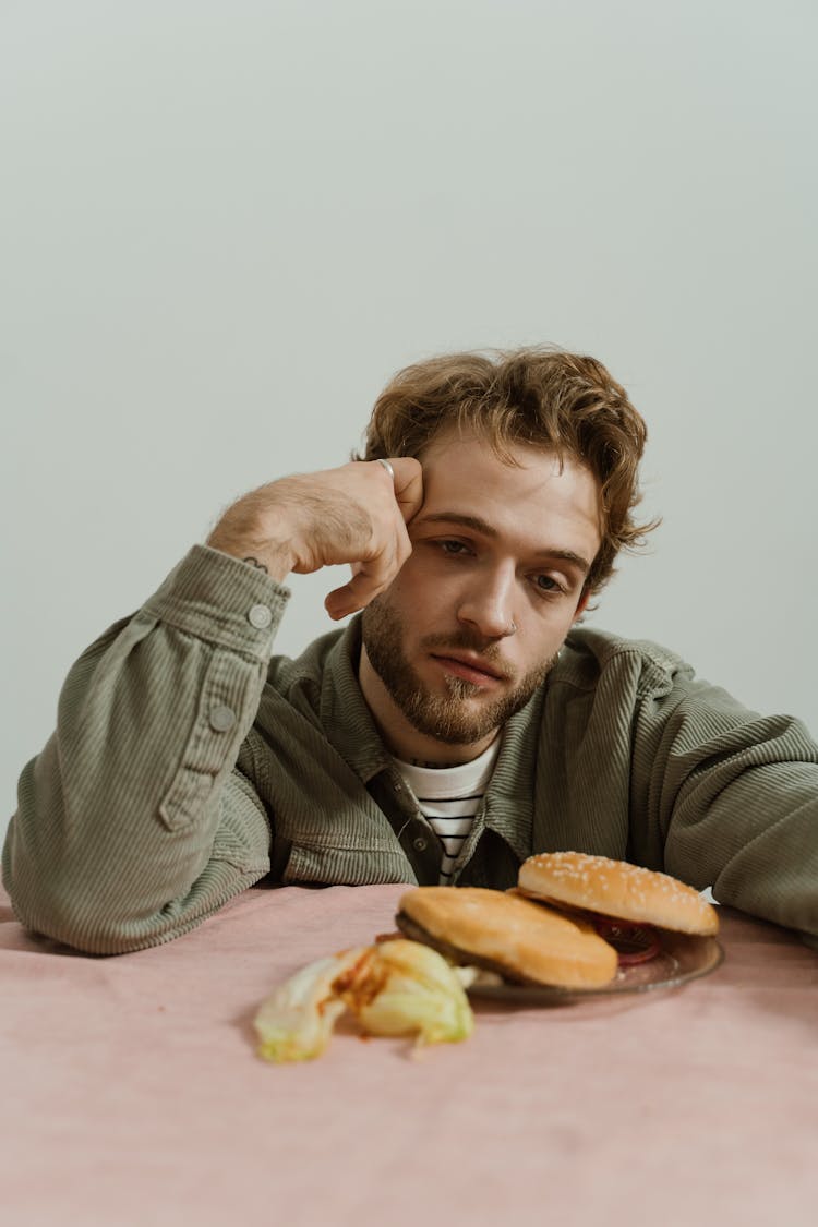 Man Thinking While In Front Of Food