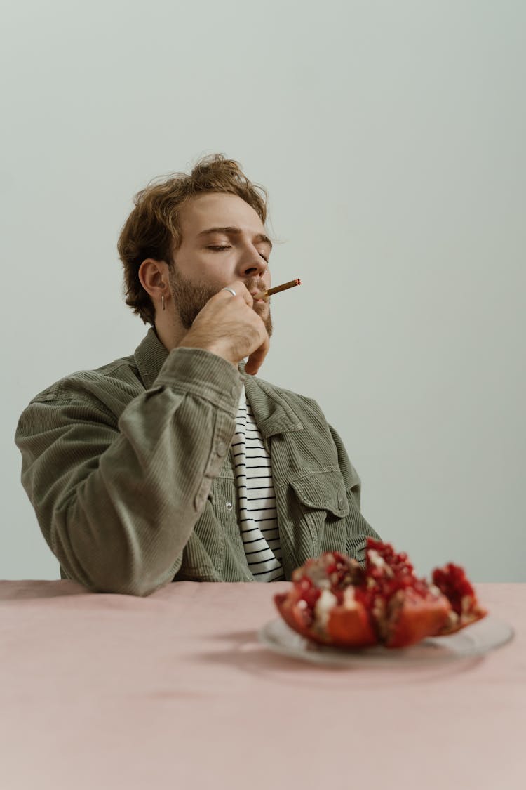 A Man Smoking A Cigarette 