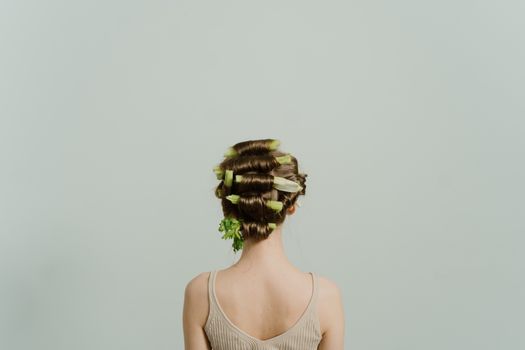 Woman in White Tank Top With Brown and White Floral Headdress