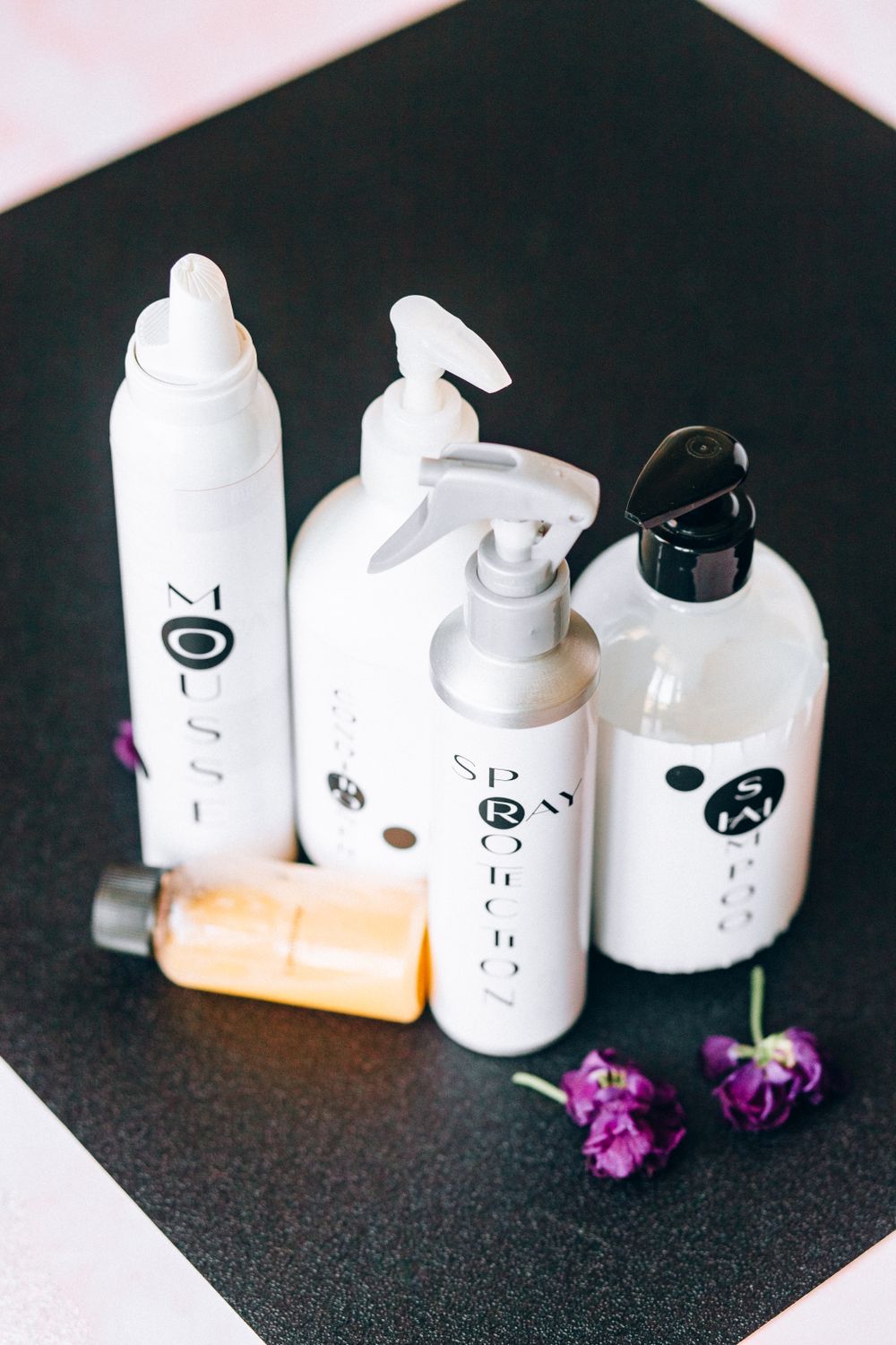 Hair care bottles with floral detail