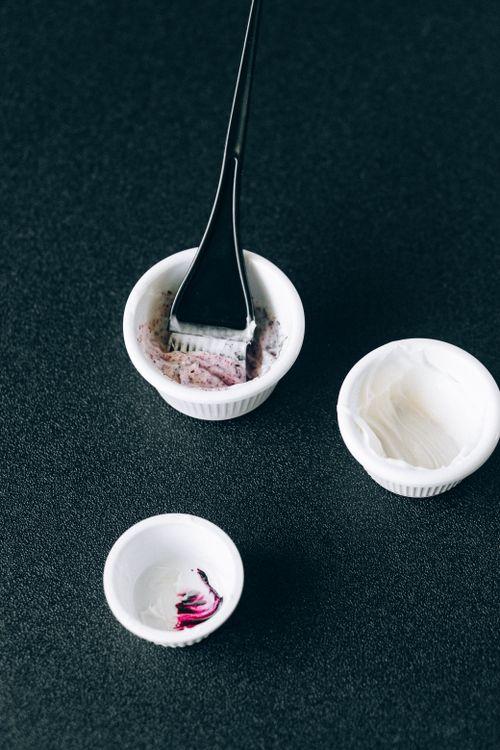 Free Hairdressing tools and dye bowls set on a textured surface, perfect for hairstyling concepts. Stock Photo