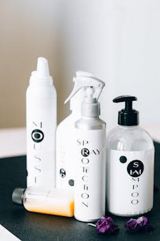 A stylish arrangement of hair care products in a minimal studio setting, perfect for a clean and modern aesthetic.
