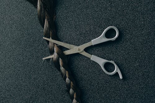 Photo of Scissors and Braided Hair