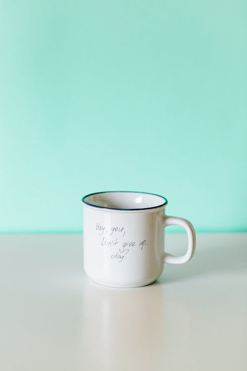 White Ceramic Mug on White Table