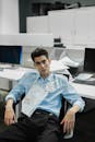 A Man in Blue Dress Shirt Sitting on Chair with a Deadline Reminder