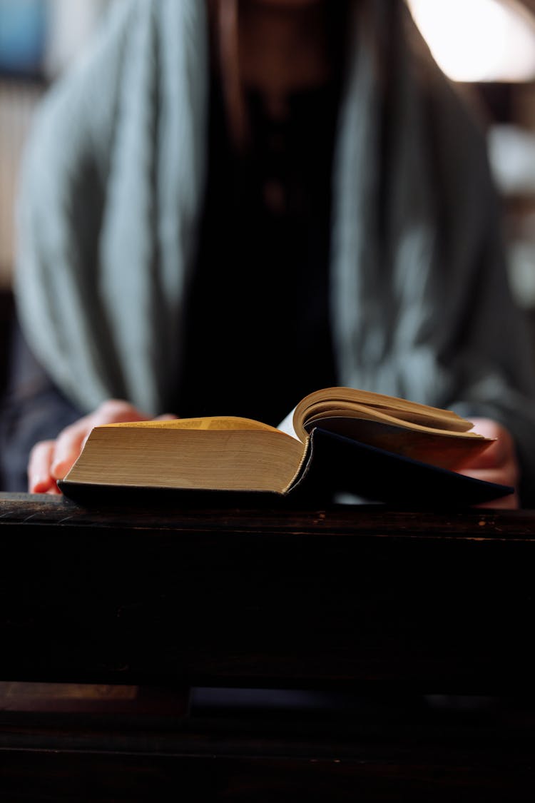 A Person Holding A Book