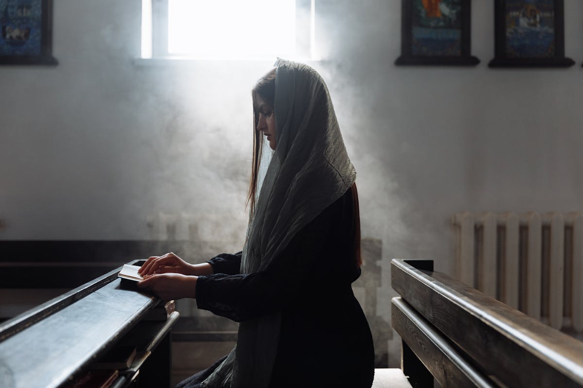 Pediatrician administering a vaccine to a young child while the parent holds their hand.