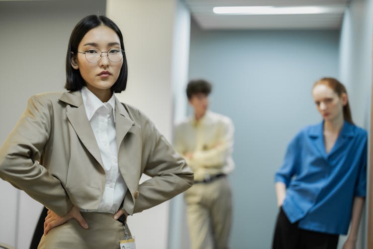 Man And Women Standing In Office