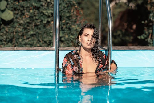 Woman In Pool By the Handrails