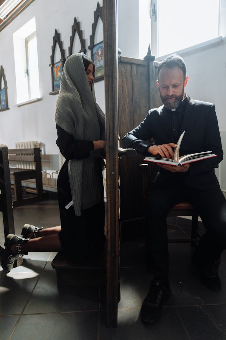 Woman Confessing To A Priest