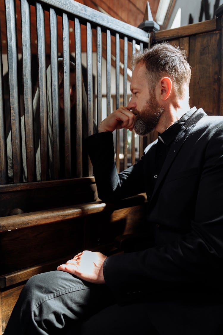 Priest Hearing Confession In Church