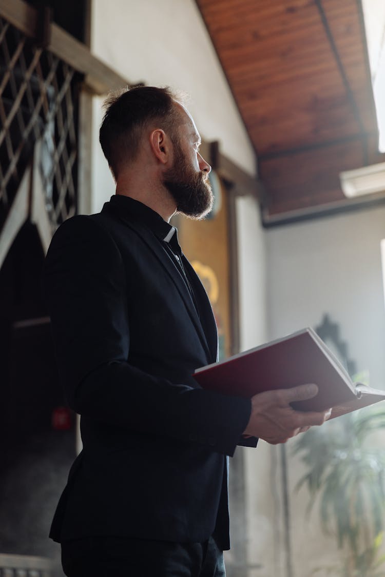 Bearded Man Holding A Book