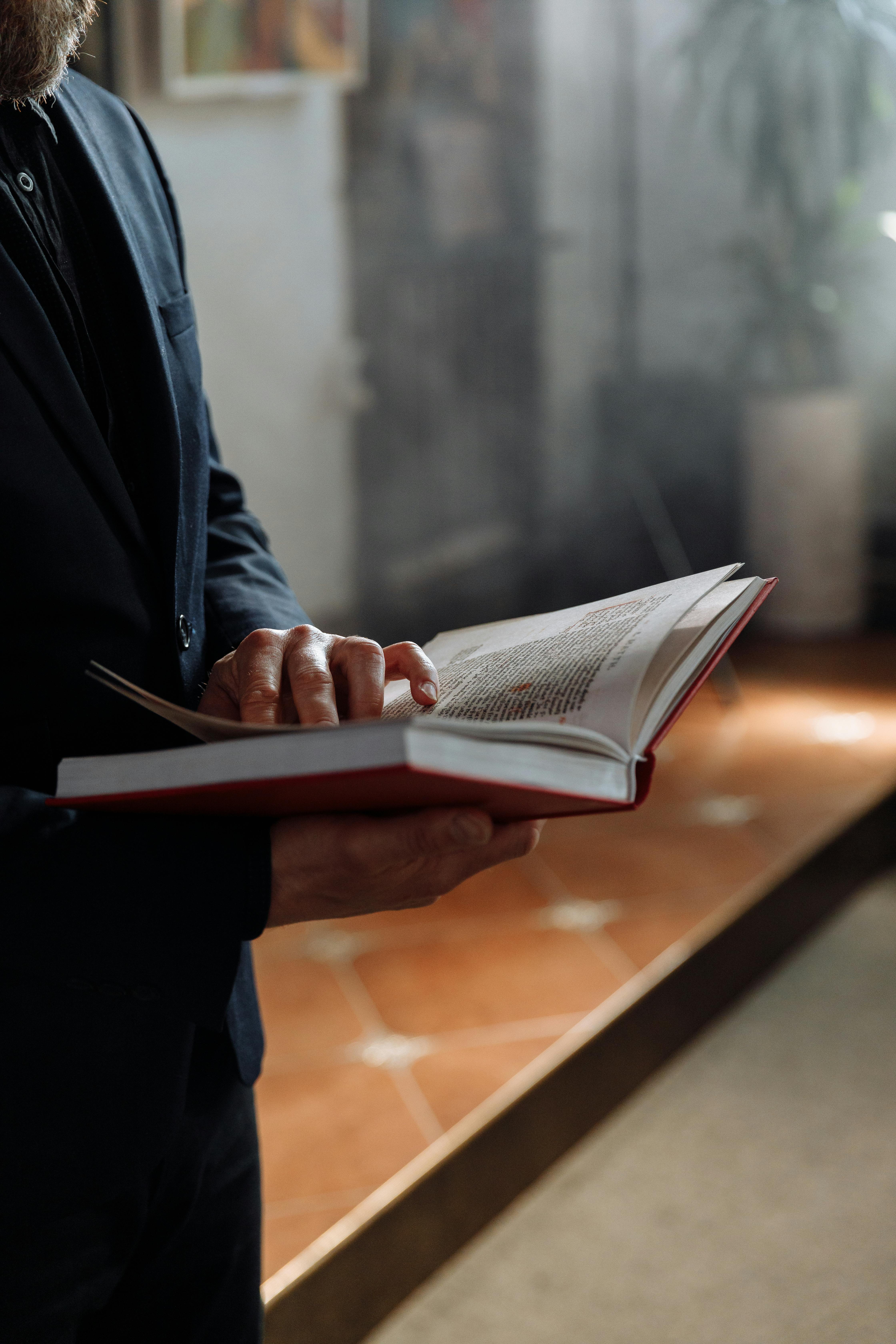 priest reading a bible