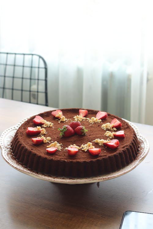 Free Chocolate Cake with Strawberries on Top on Wooden Table Stock Photo