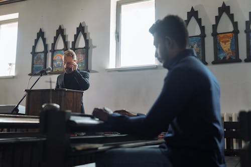 Priest and Believer in Church