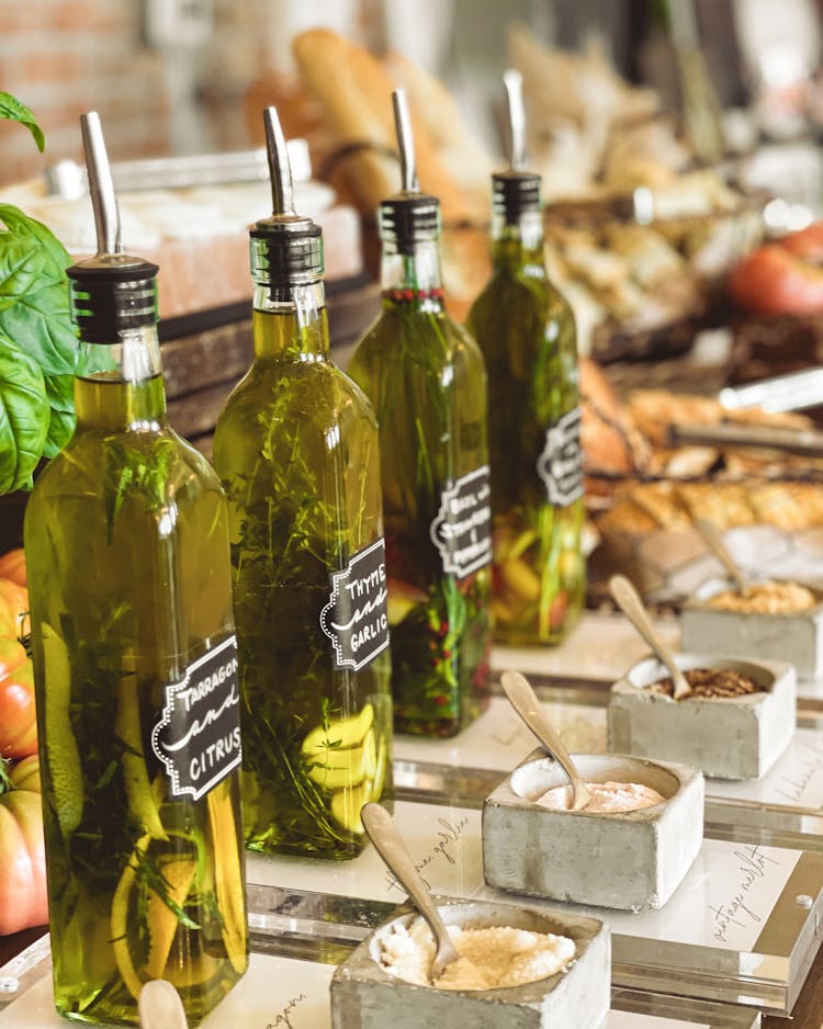 A Selection Of Infused Oils In Bottles