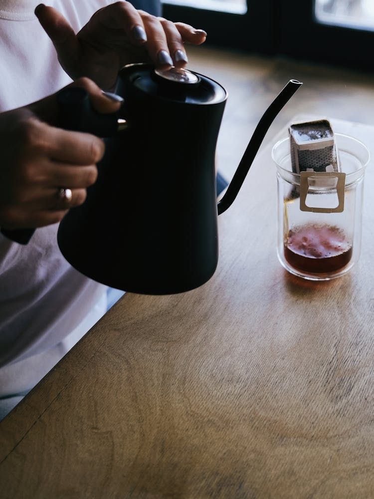 Close-up Of Person Making Filter Coffee