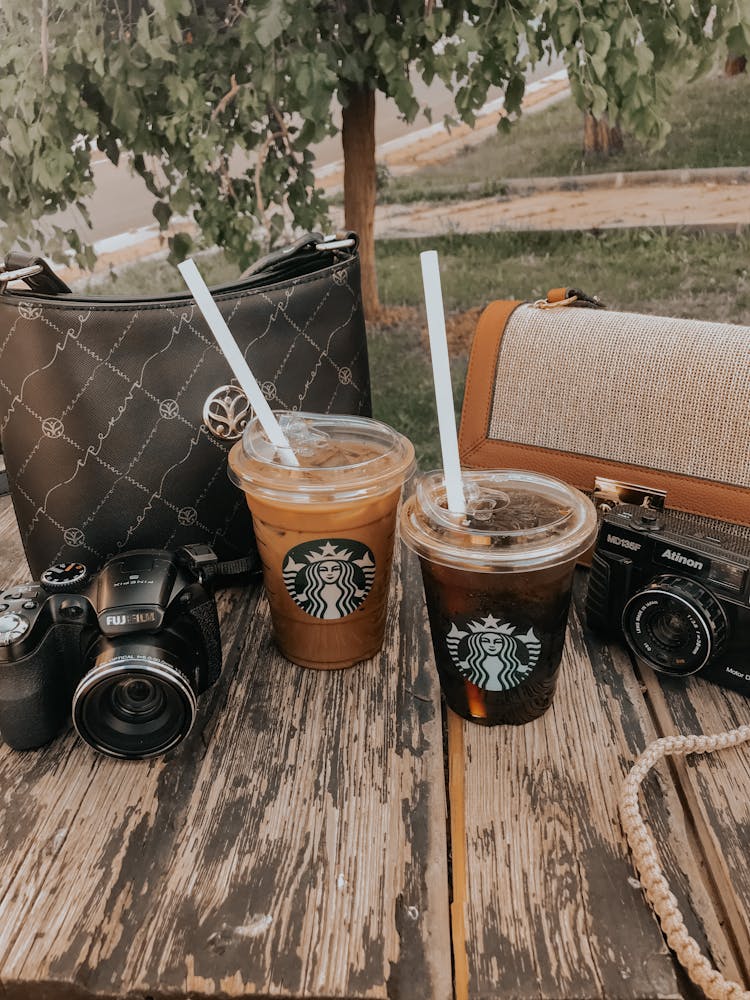 A Starbucks Coffees On A Wooden Surface