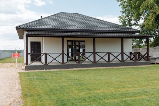 Modern house for sale with a spacious lawn and inviting facade, perfect for families.