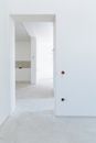 White Wooden Door Near White Wall