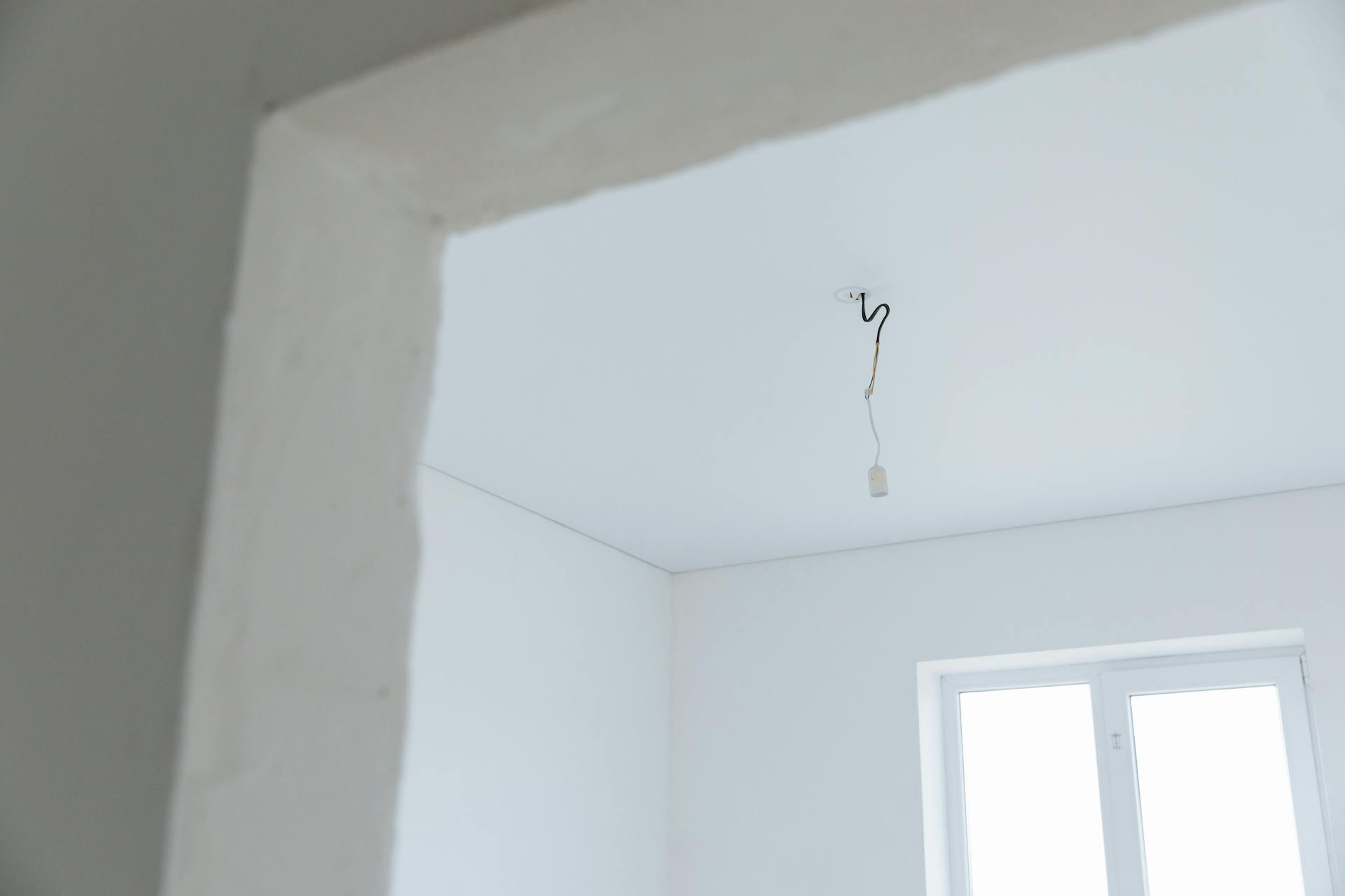 White Ceiling with Electrical Wiring Poking Out