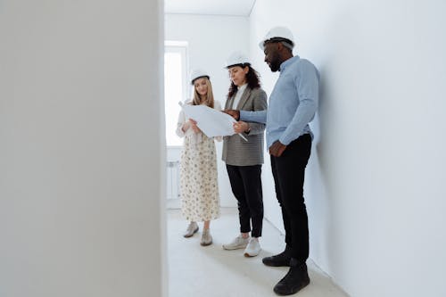 Man and Women Looking at House Plan