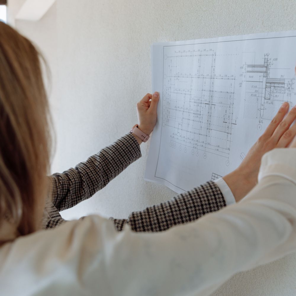 Wallpapering in Stepney — careful masking before painting begins