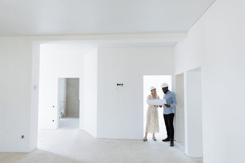 Man and Woman Standing at the Doorway