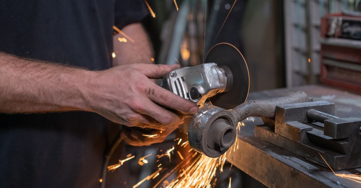 A Person Using a Grinder · Free Stock Photo