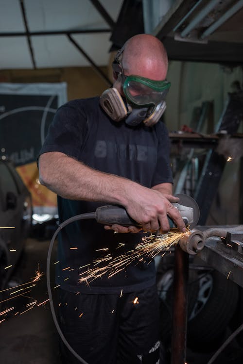 
A Man Using a Grinder