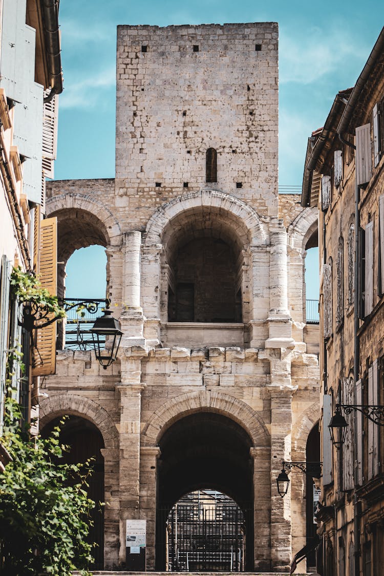 Arles Amphitheatre Under Blue Sky