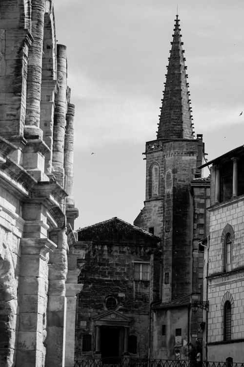 Free Grayscale image of a historic bell tower in Arles, France, showcasing Gothic architecture. Stock Photo