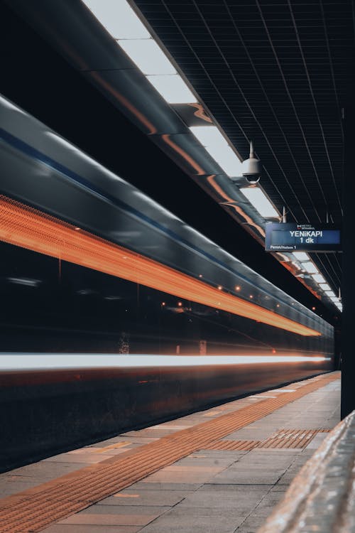 A Moving Train in a Train Station